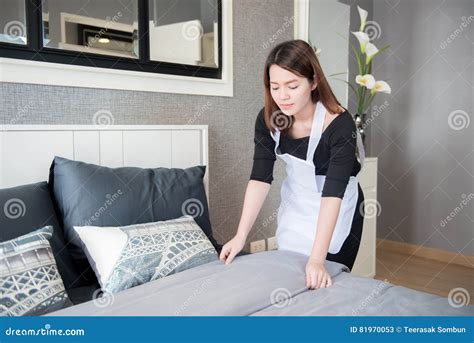 Young Maid Tidying Up Bed in Hotel Room, Cleaning Service Concept Stock ...