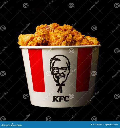 A Lots Of KFC Chicken Hot Wings Or Strips In Bucket Of KFC Kentucky Fried Chicken Fast Food ...