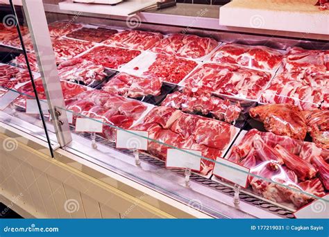 Selection of Raw Fresh Lamb Meat in the Refrigerated Display of a Butcher Shop Stock Image ...