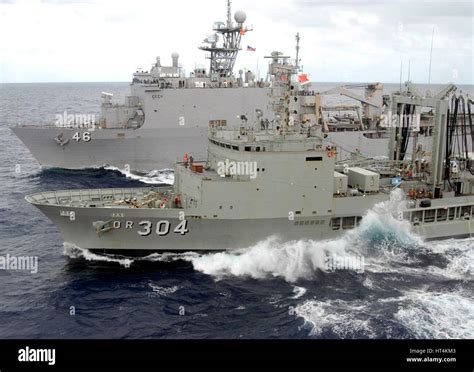 The USN Whidbey Island-class dock landing ship USS Tortuga (left) conducts an underway ...