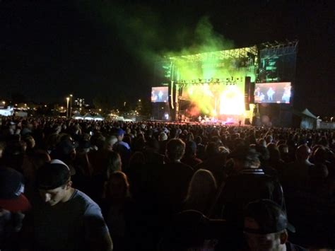 Concert goers at Ottawa Bluesfest embrace the rain with open arms | Complex CA