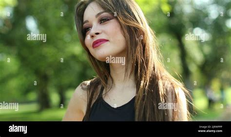 Happy young woman nodding yes with head in outdoor park. Pretty girl ...