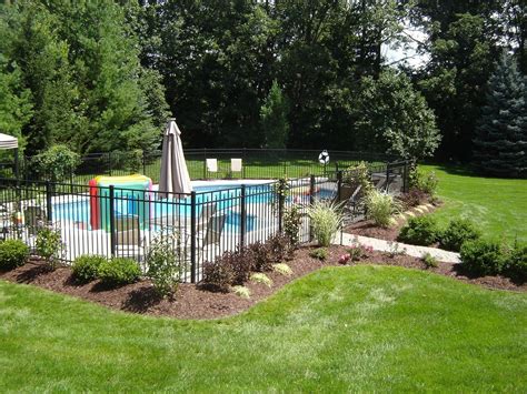 Exterior: Black Iron Fences Around Pool Landscaping Ideas In Some Brick Wall Design… | Inground ...