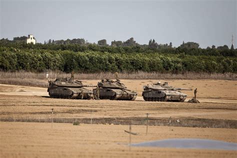 Two Merkava Mk 4 tanks and one Mk 3D