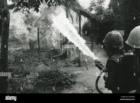 Marines using a flamethrower to destroy a structure during Operation New Castle. Vietnam, March ...