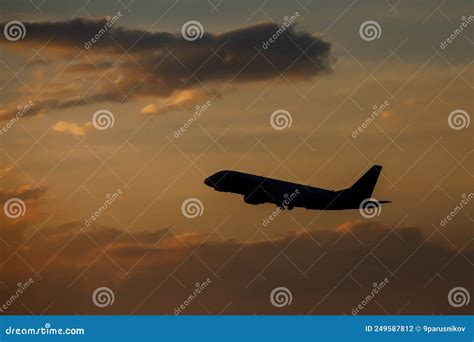 Silhouette of an Airplane Flying at Sunset Clouds. Stock Photo - Image of vacation, sunset ...