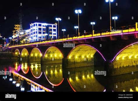 Stone arch bridge in the night Stock Photo - Alamy