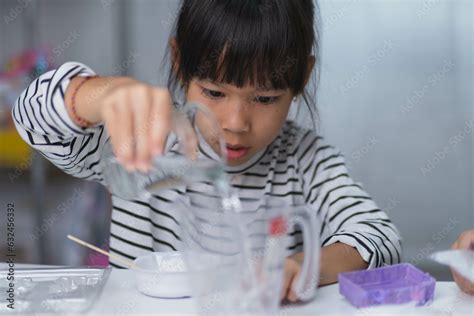 Cute little girl making DIY plaster and painting at home. Children ...