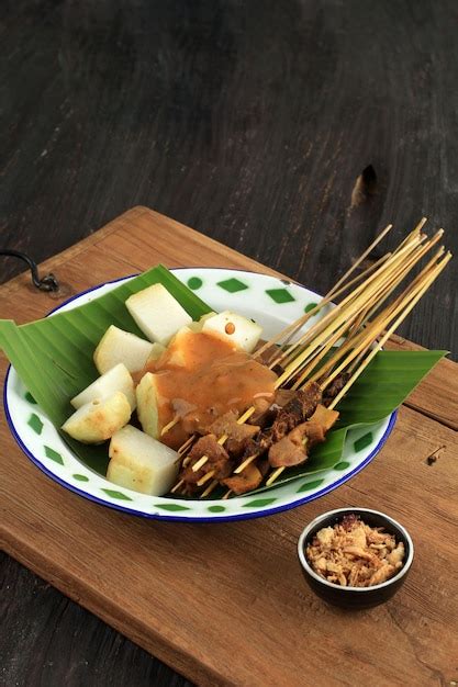 Premium Photo | Sate padang or satay padang spicy beef satay from ...