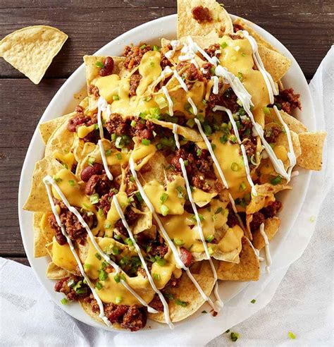 Chili Cheese Nachos are nachos piled high with my homemade chili and cheese sauce. They are a ...