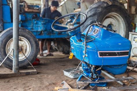 Repairing tractors stock image. Image of heavy, line - 62473403