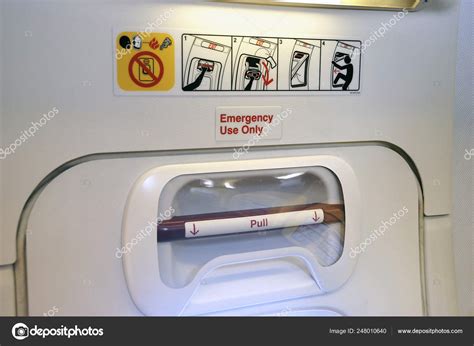 Emergency Exit at an airplane – Stock Editorial Photo © jehoede #248010640