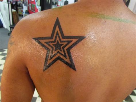 Star tattoos can be a symbol of fame or notoriety. A star within a star ...