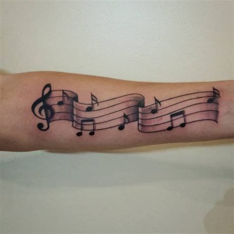 Music notes tattoo, Sheet music tattoo, Music note tattoo