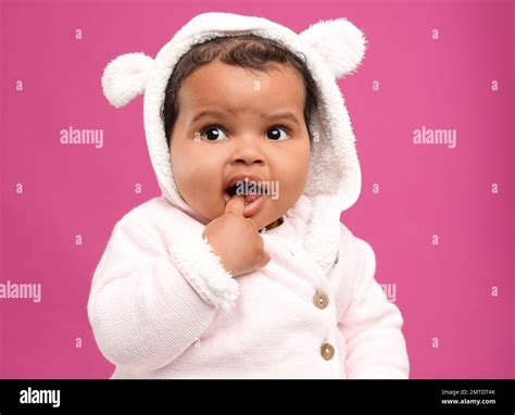 Cute African American baby on pink background Stock Photo - Alamy