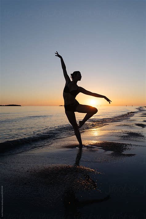 "Silhouette Of A Dancer On The Seashore At Sunset." by Stocksy Contributor "Luis Velasco" - Stocksy