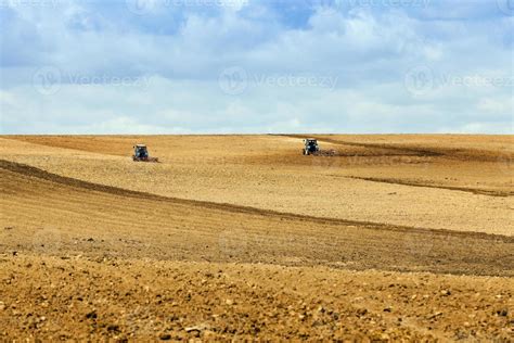 tractor plowing the fields 9673633 Stock Photo at Vecteezy