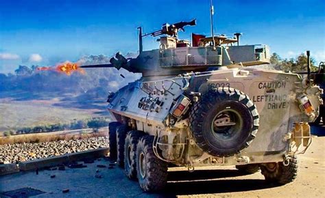 An ASLAV fires its 25mm M242 Bushmaster Chain gun during squad Support training at the ...