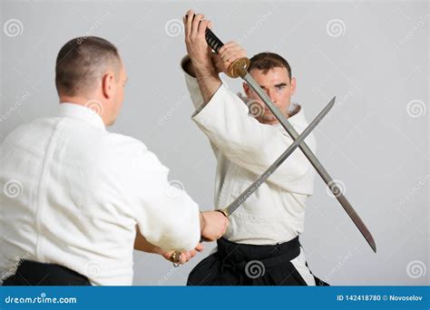 Sword fight stock photo. Image of hands, aikido, body - 142418780