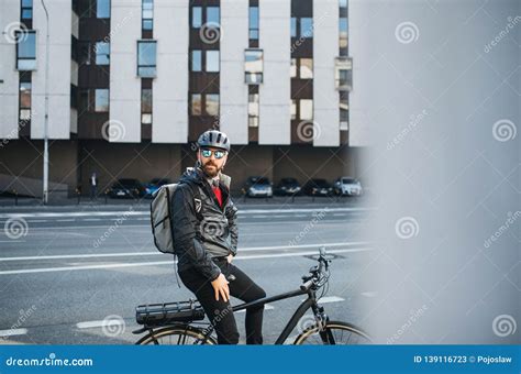 Male Bicycle Courier with Backpack and Sunglasses Delivering Packages in City. Stock Image ...