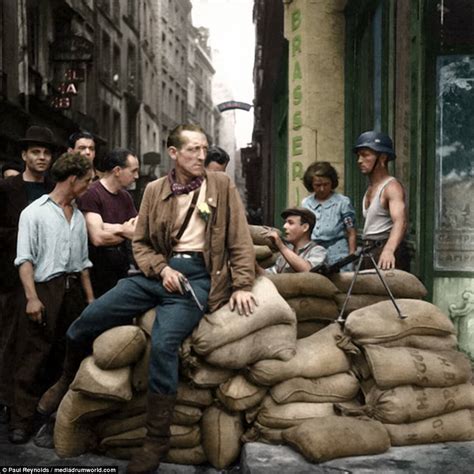 [COLOR] French Resistance fighters man a barricade in Paris in August-1944. : wwiipics