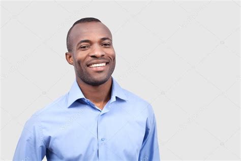 Young black man smiling at camera Stock Photo by ©gstockstudio 37034497