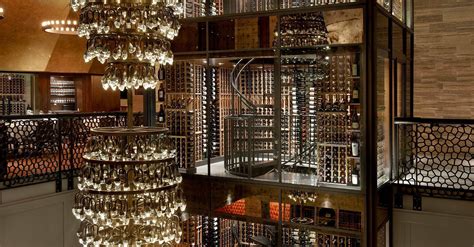 Del Frisco’s Chicago - Four Story Glass Enclosed Wine Cellar Tower with Traditional Wooden Racking