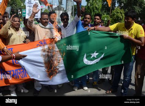 Vishwa Hindu Parishad (VHP) activists burn Pakistan's National Flag ...