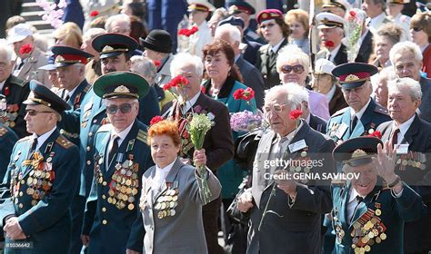 Ukrainian World War II veterans with medals and orders wave flowers... News Photo - Getty Images