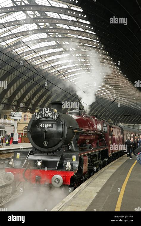 LMS Jubilee class steam locomotive 45699 "Galatea" at York station, UK with the Scarborough Spa ...