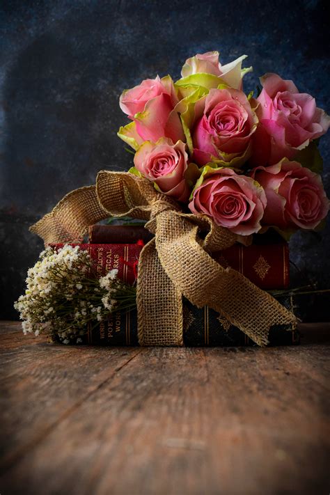 The roses and book on Behance