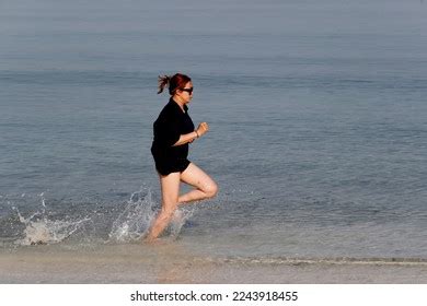 Sport Woman Running Barefoot On Beach Stock Photo 2243918455 | Shutterstock