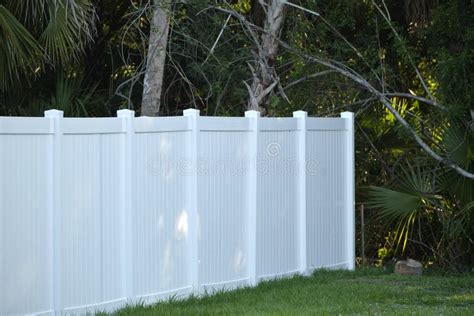 White Plastic Fence for Back Yard Protection and Privacy Stock Photo - Image of house, yard ...