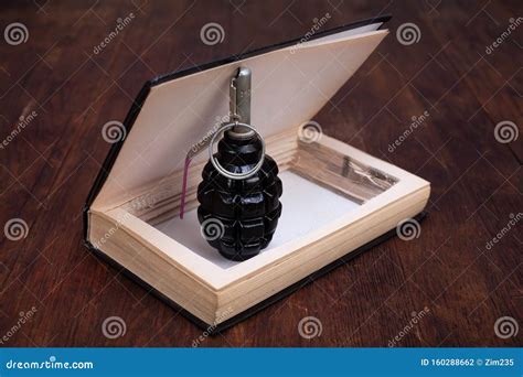 Hand Grenade Hidden in a Book Stock Photo - Image of kill, security: 160288662