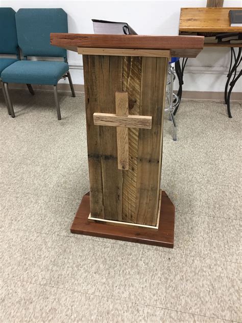 a wooden cross on top of a table in a room