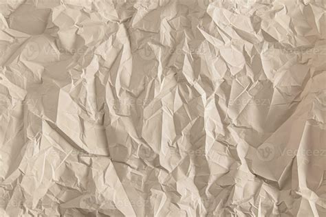 The texture of the crumpled paper is light brown. abstract paper background. A copy of the space ...