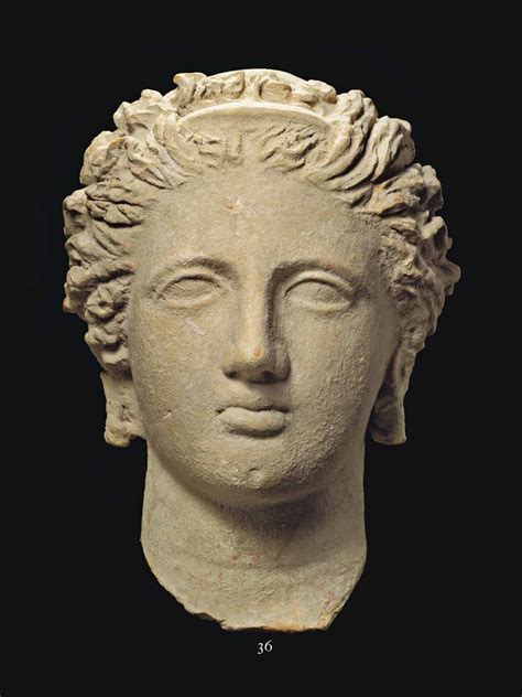 A GREEK TERRACOTTA VOTIVE FEMALE HEAD, TARAS, HELLENISTIC PERIOD, CIRCA 4TH-3RD CENTURY B.C ...