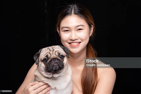 Asian Woman Hugging Dog Pud Breed With Love Happiness Emotional Isolated On Black Background ...