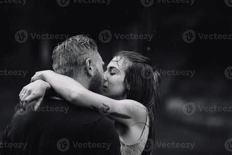 beautiful couple hugging in the rain 11525566 Stock Photo at Vecteezy