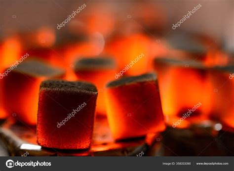 Burning hookah coals — Stock Photo © Rafinade #358333390