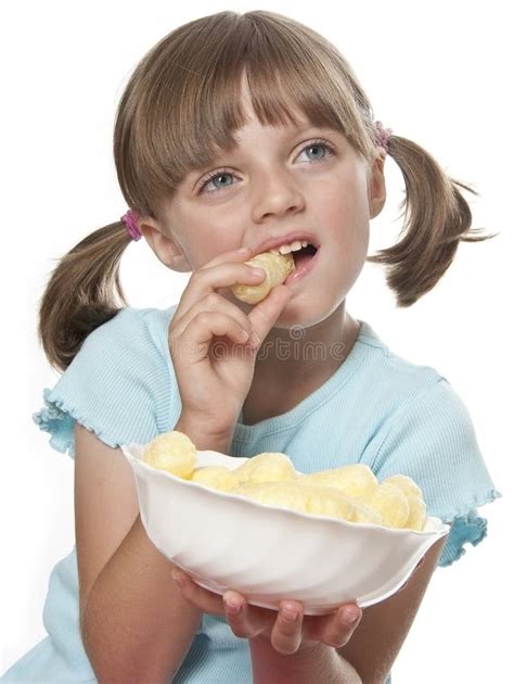 Little Girl Eating A Potato Chips Stock Photography - Image: 26212192