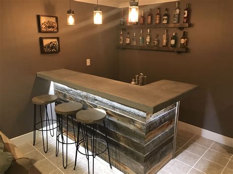 Concrete bar top with reclaim wood bar. Rustic man cave vibe Rustic Basement Bar, Basement Bar ...