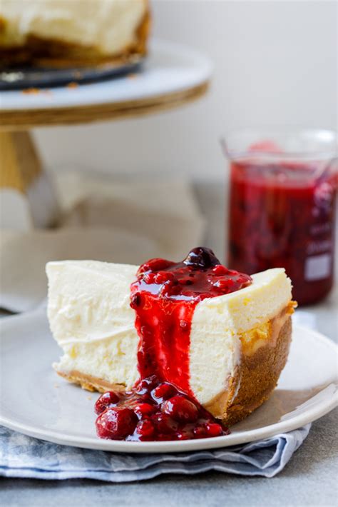 Classic lemon cheesecake with easy berry sauce - Simply Delicious