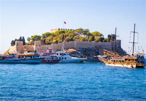 Ferries near Island with Castle · Free Stock Photo