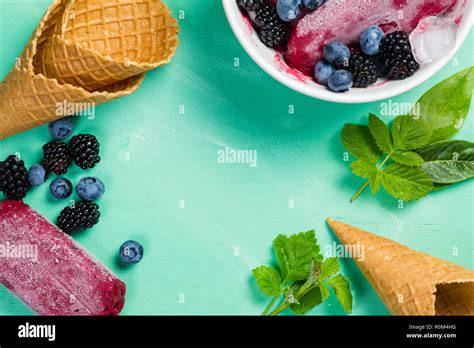 Berry ice cream on rustic wood background Stock Photo - Alamy