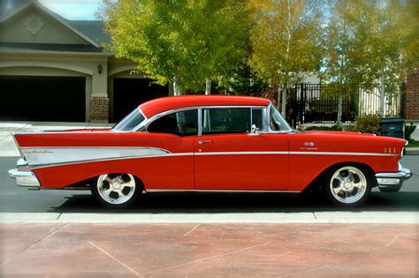 RED FOR THE HOLIDAYS THIS SANTA'S CRUISER "57 CHEVY BEL AIR" READY FOR A BIG BOW