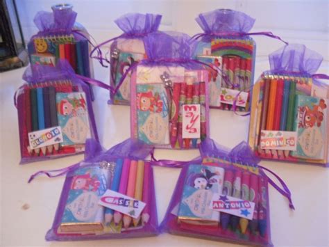 Personalised children's activity pack favours. Organza bag packed with ...