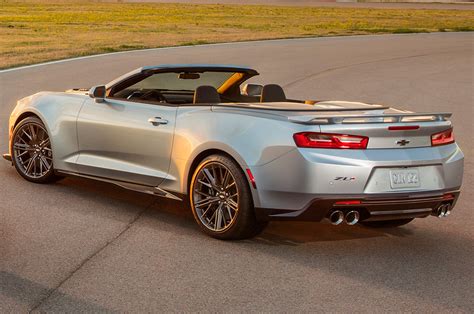 the rear end of a silver chevrolet camaro convertible