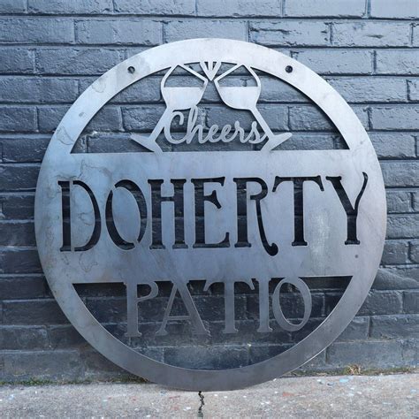 a metal sign on the side of a brick wall that says doherty patio