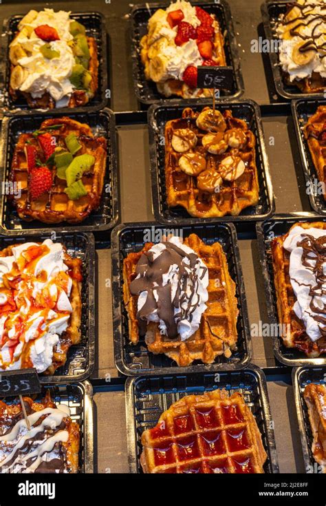 Belgian waffles with colorful toppings on showcase. Brussels Stock ...